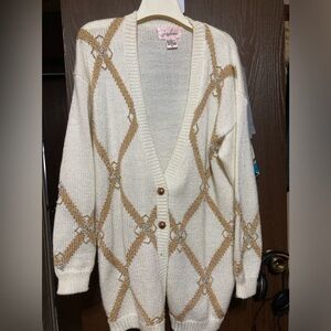 vintage Jaclyn Smith sweater witha metallic button-down design andbeaded accents